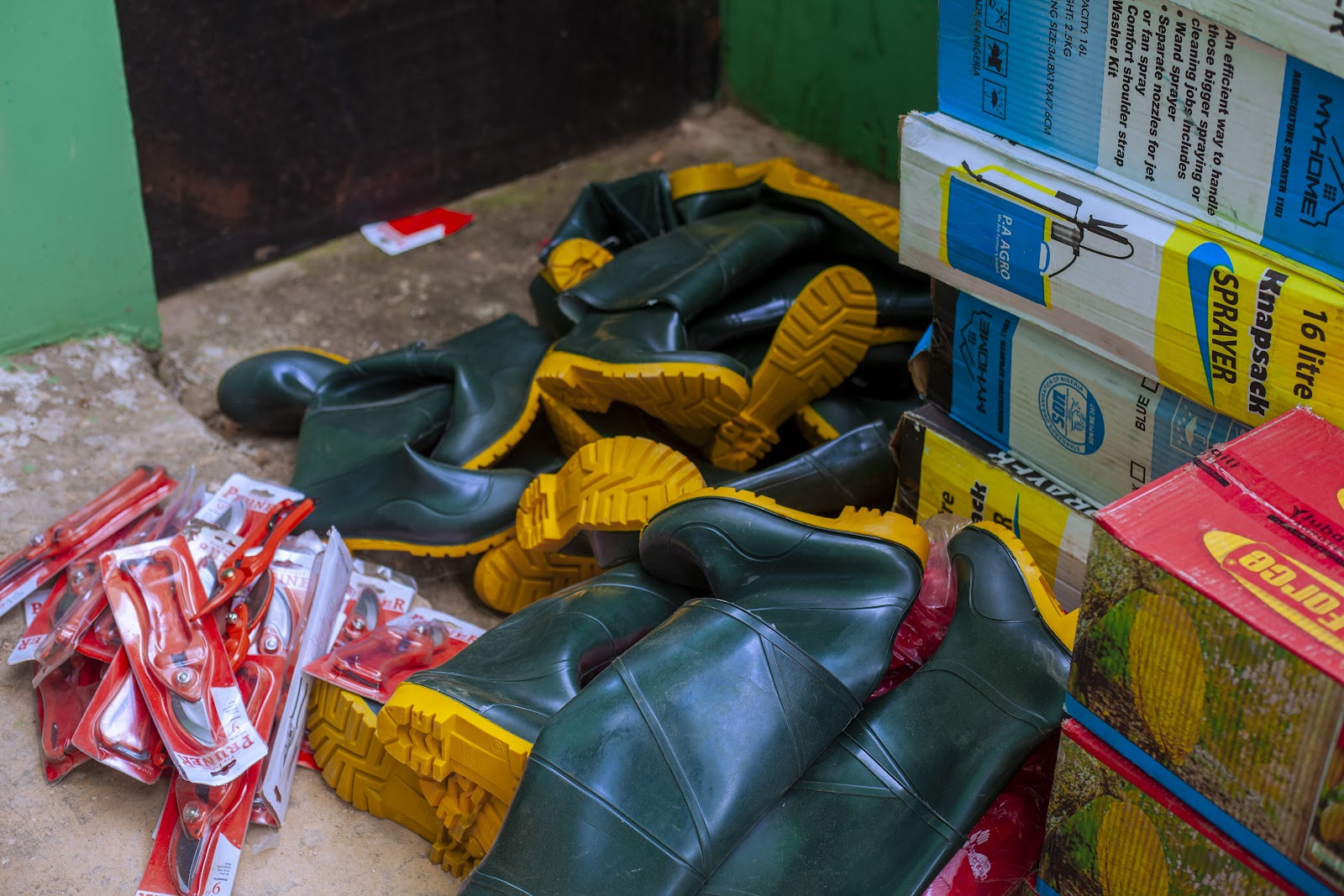 Boots and packaged field items prepared during a Rasad farmer intervention